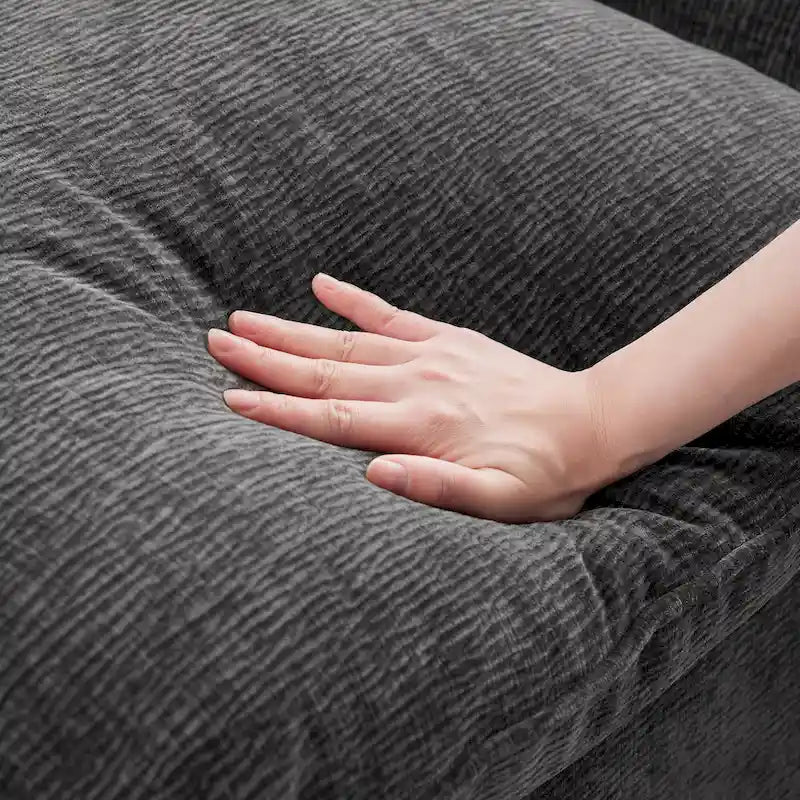 Canapé d'angle modulaire 5 places en chenille noire 84 avec 2 coussins, idéal pour le salon ou l'appartement.