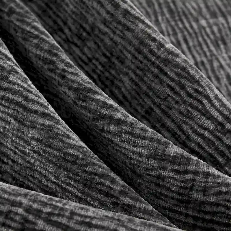 Canapé d'angle modulaire 5 places en chenille noire 84 avec 2 coussins, idéal pour le salon ou l'appartement.